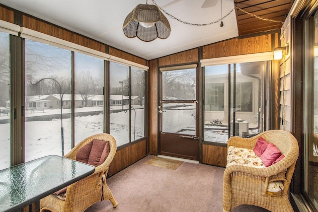 sunroom / solarium featuring ceiling fan and lofted ceiling