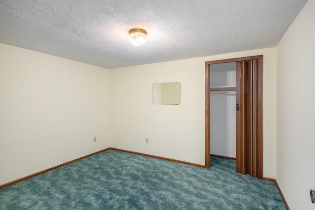 unfurnished bedroom with a textured ceiling, carpet floors, and a closet