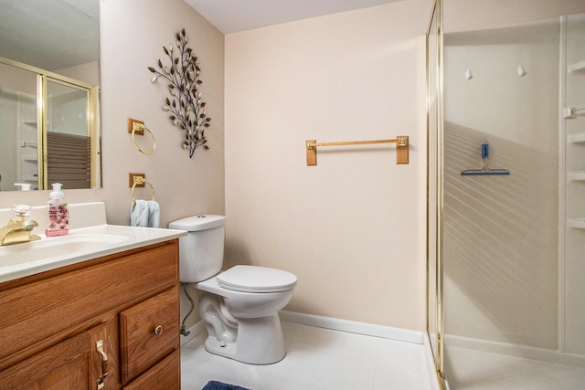 bathroom featuring vanity, an enclosed shower, and toilet