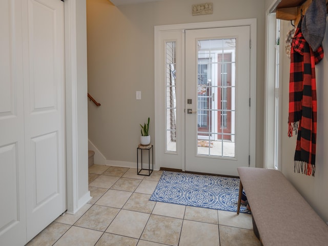 foyer featuring light tile patterned flooring