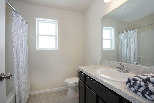 bathroom featuring tile patterned flooring, vanity, and toilet