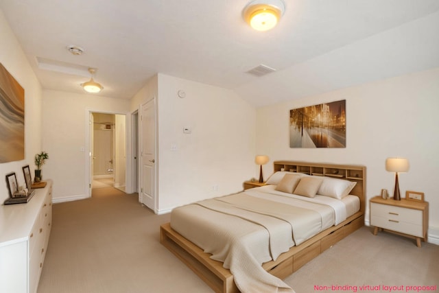 carpeted bedroom with ensuite bathroom and vaulted ceiling