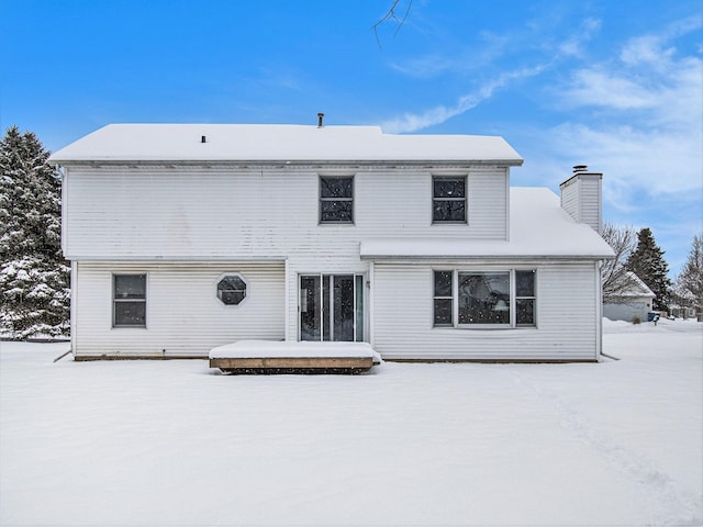 view of snow covered property