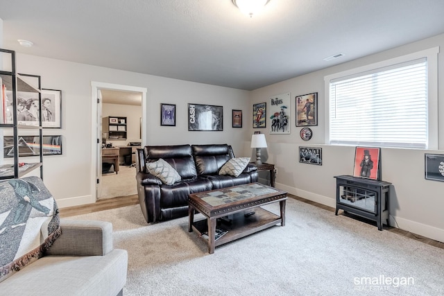 living room featuring light carpet