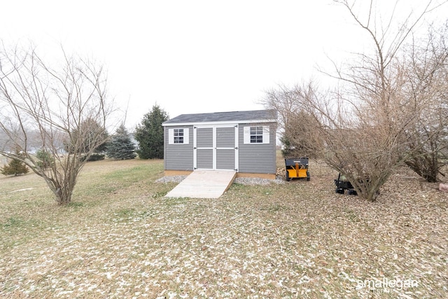 view of outdoor structure with a yard