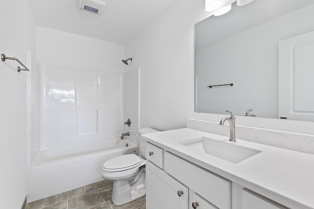 full bathroom with tile patterned floors, vanity, shower / bath combination, and toilet