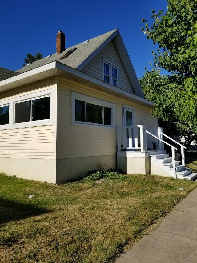 view of home's exterior featuring a lawn