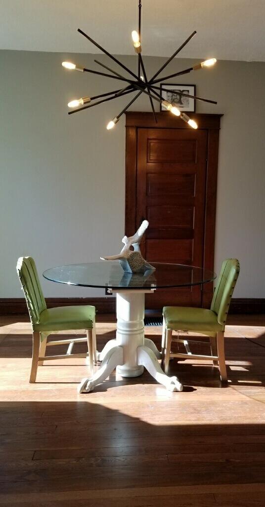 dining room with light hardwood / wood-style floors and a chandelier