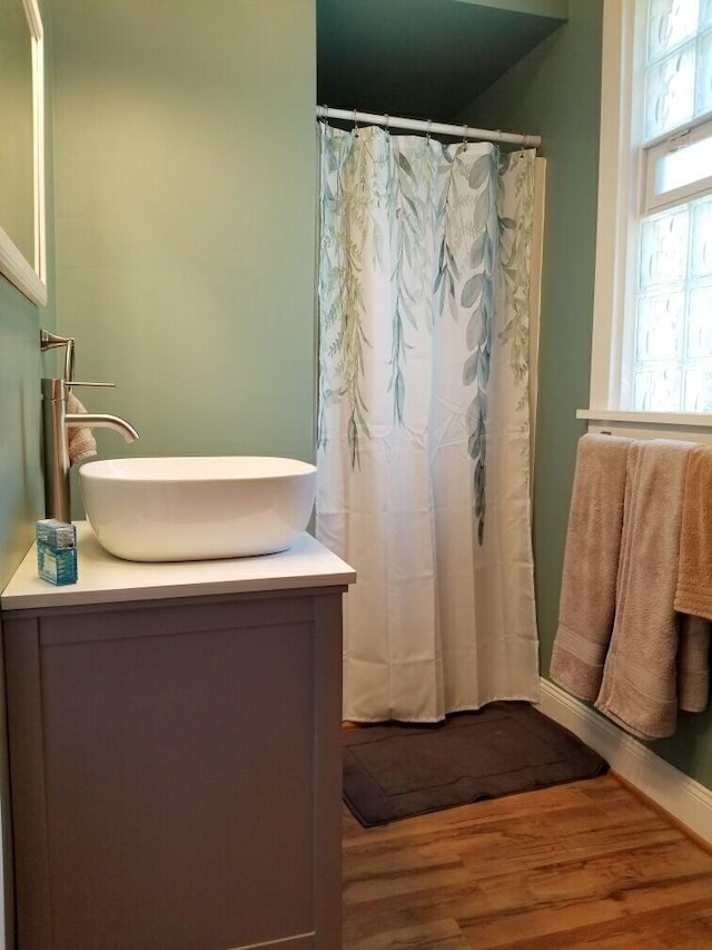 bathroom with wood-type flooring and vanity