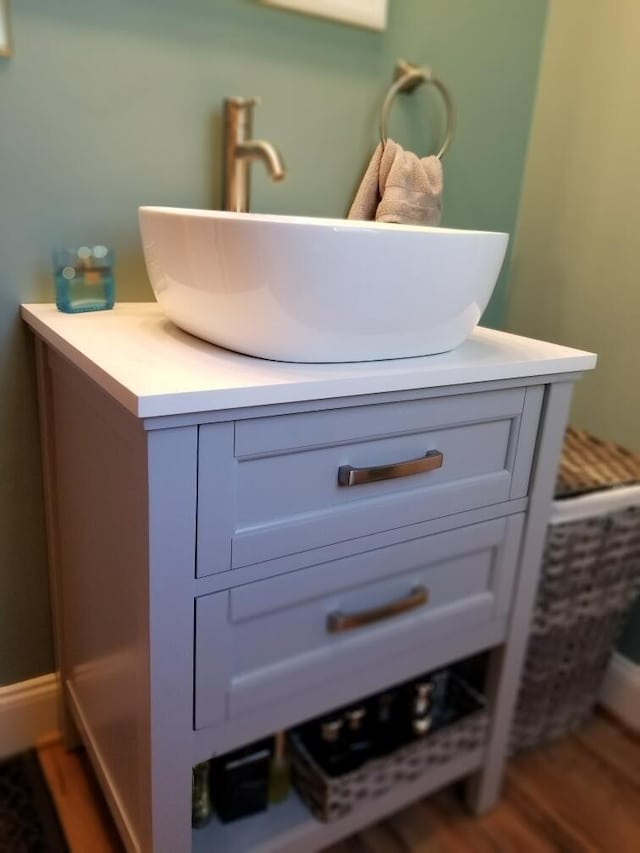 bathroom with hardwood / wood-style floors and vanity