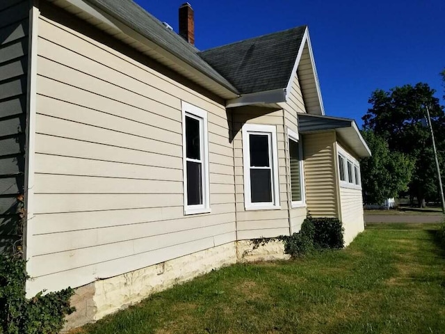 view of property exterior featuring a yard