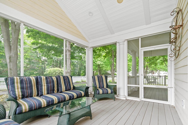 sunroom / solarium with vaulted ceiling