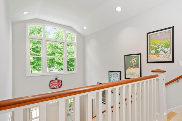 hallway featuring lofted ceiling