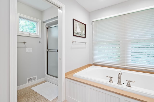 bathroom with independent shower and bath