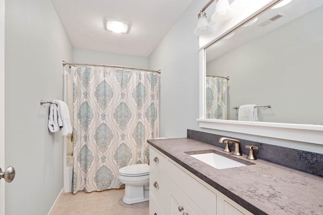 full bathroom with shower / bath combination with curtain, tile patterned floors, vanity, a textured ceiling, and toilet