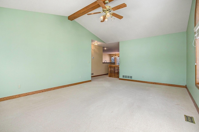 unfurnished living room with vaulted ceiling with beams, ceiling fan, and carpet flooring