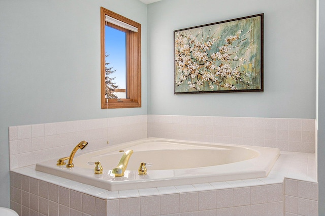 bathroom featuring tiled tub