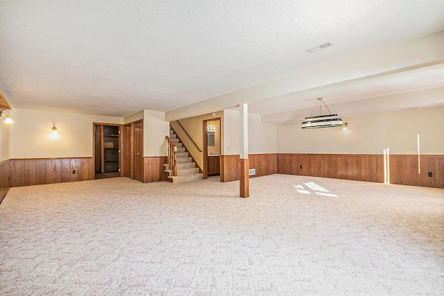 basement with a textured ceiling and carpet