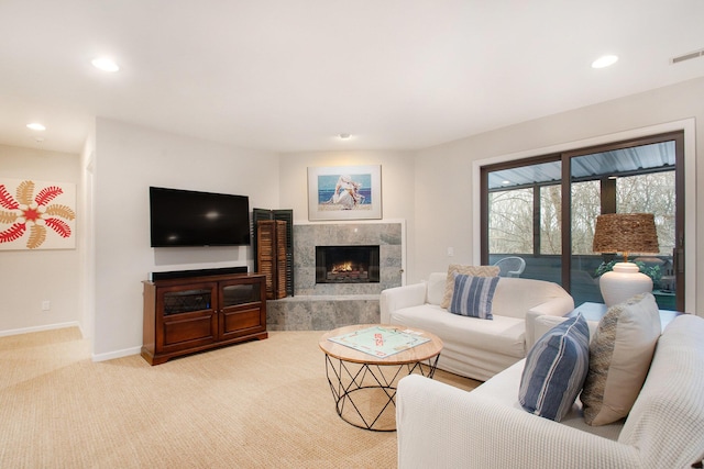 carpeted living room featuring a high end fireplace