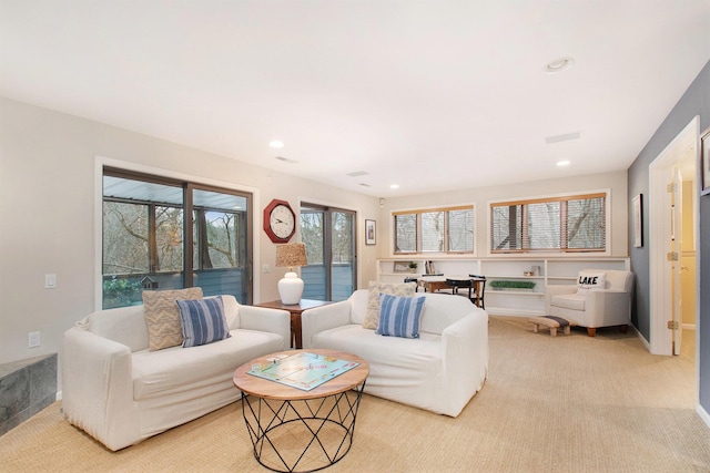 living room featuring light carpet