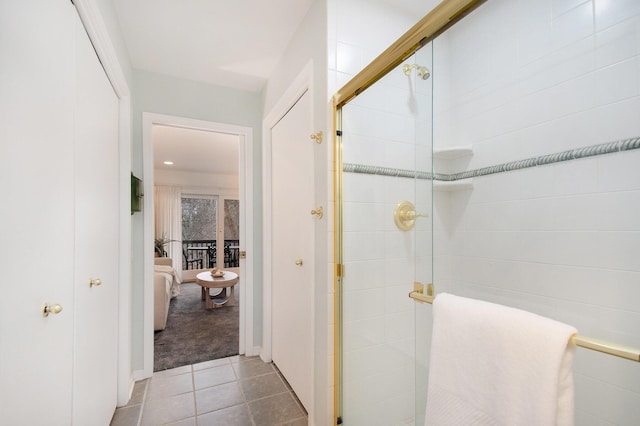 bathroom with tile patterned flooring and an enclosed shower