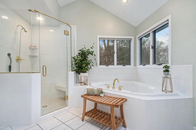 bathroom featuring tile patterned floors, independent shower and bath, and lofted ceiling