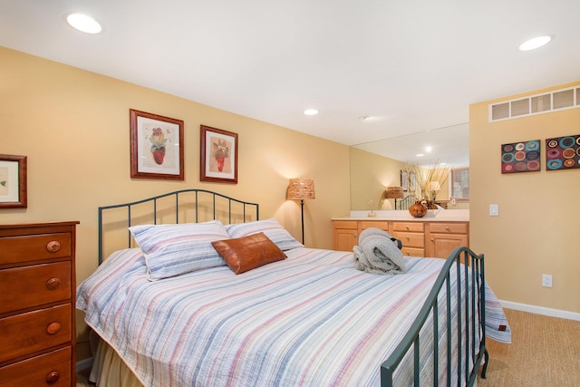 bedroom with light colored carpet