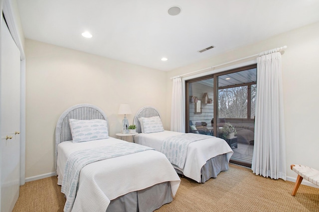 bedroom with light colored carpet and access to outside