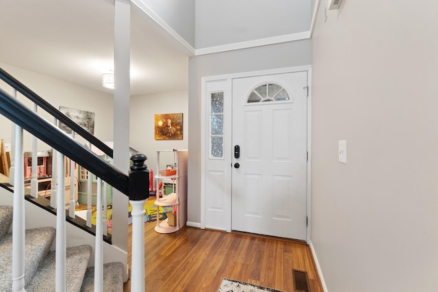 entryway with hardwood / wood-style flooring