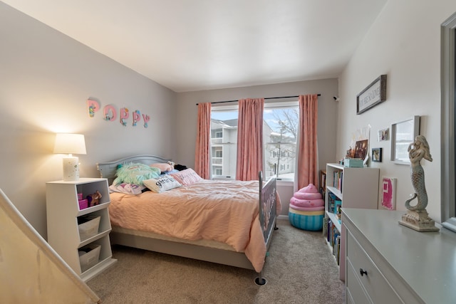 bedroom with light colored carpet