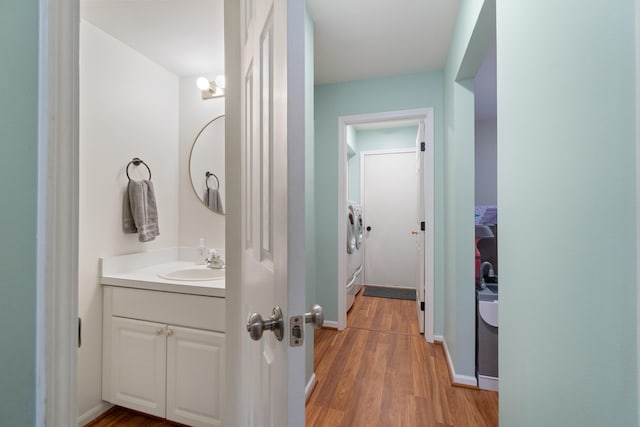 bathroom featuring wood-type flooring and vanity