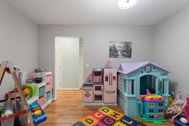 recreation room featuring light hardwood / wood-style flooring