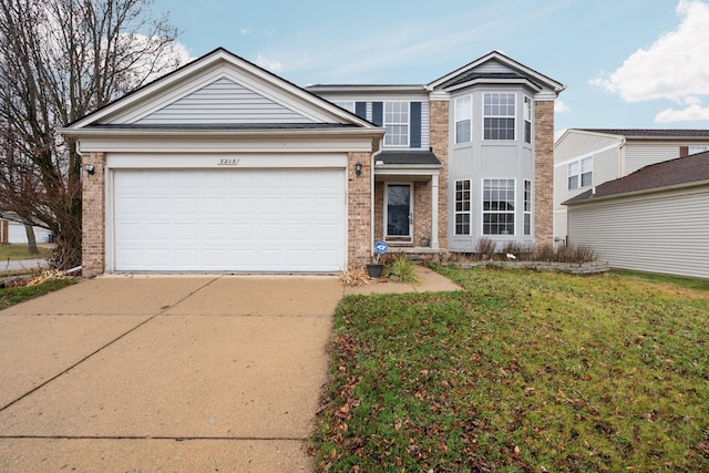 front of property with a front lawn and a garage