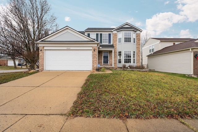 view of front property featuring a front yard and a garage