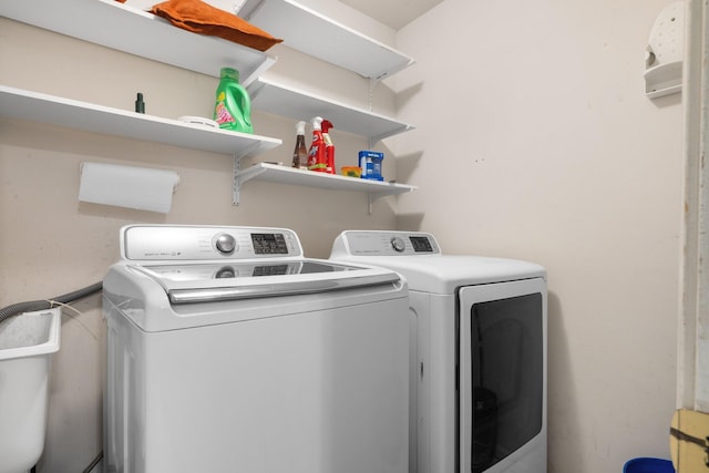 washroom with separate washer and dryer