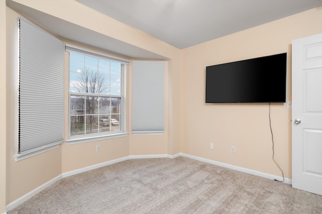 empty room featuring light colored carpet