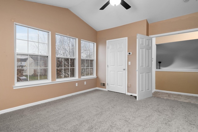 unfurnished bedroom featuring carpet, ceiling fan, and lofted ceiling