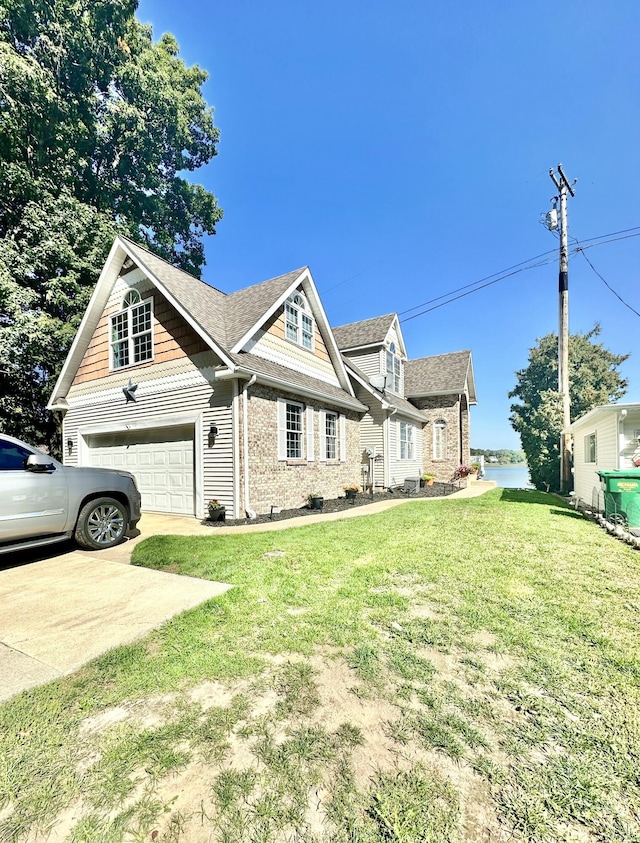 view of front of home with a garage and a front yard