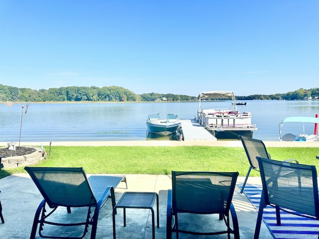 exterior space with a water view and a dock