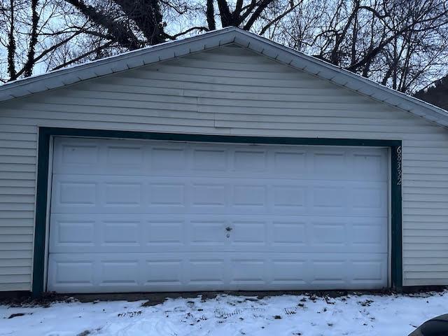 view of snow covered garage