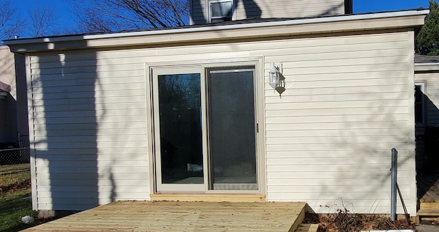 view of side of property featuring a deck