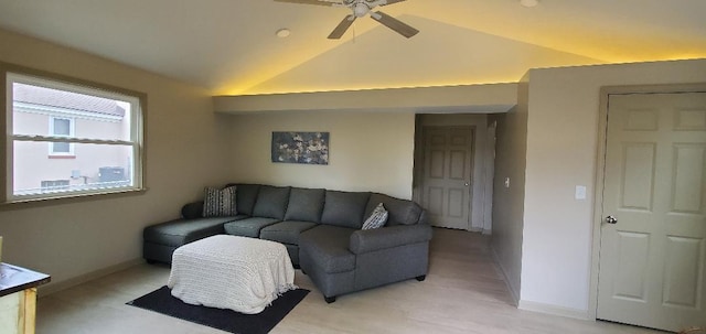 living room featuring vaulted ceiling, baseboards, and ceiling fan