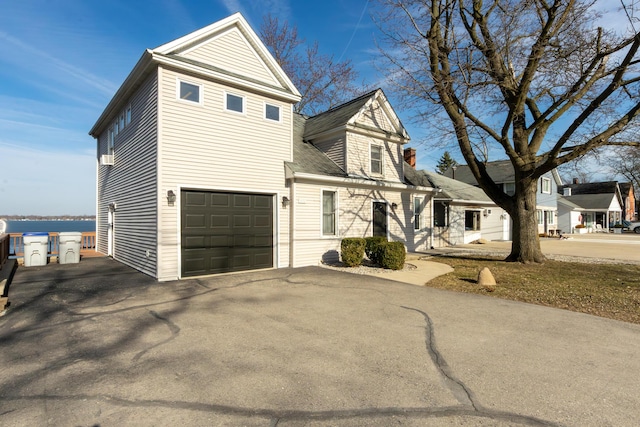 view of front facade featuring driveway and an attached garage