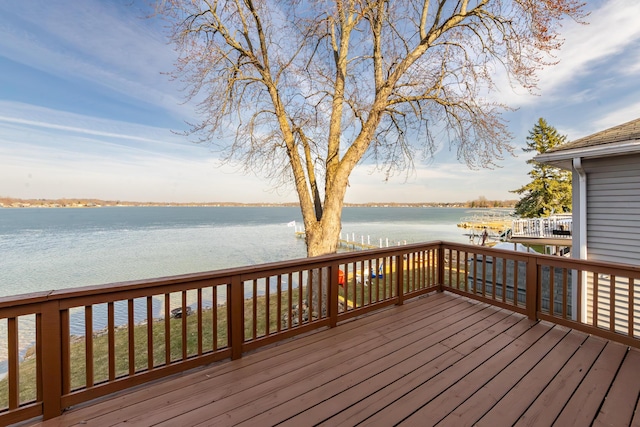 wooden deck featuring a water view