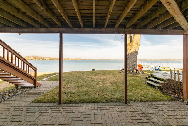view of patio with a water view