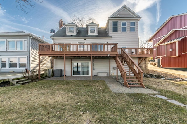 back of house with cooling unit, stairway, a deck, a yard, and a chimney