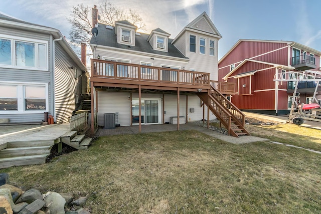 rear view of property with a patio, stairs, a yard, and a deck