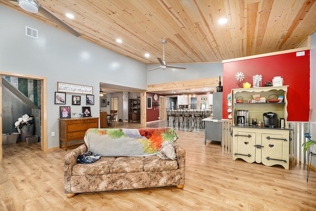 living room featuring wooden ceiling, high vaulted ceiling, light hardwood / wood-style floors, and ceiling fan