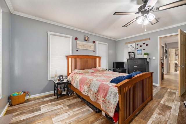 bedroom featuring hardwood / wood-style floors, ceiling fan, and crown molding