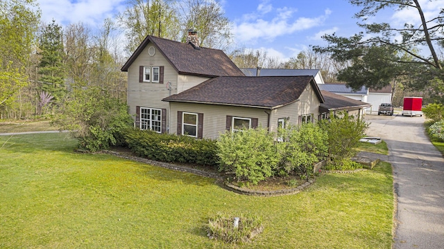 view of property exterior with a yard